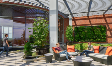 People walking across a patio next to a building