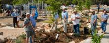 Several people working together on a landscaping project.